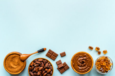 Chocolate and cocoa beans with ground powder, top view