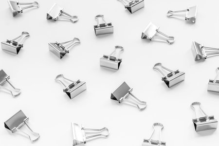 Office supplies background - paper binder clips close up