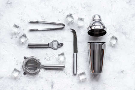 Bar tools and utensils for cocktail - with shaker, strainer and iceの写真素材