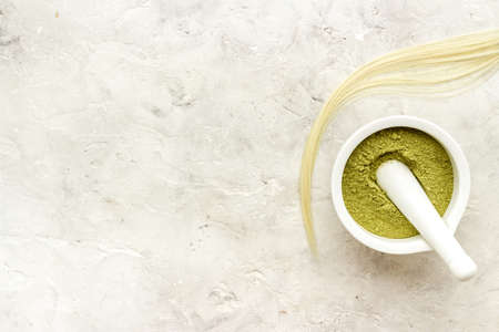 Herbal henna or mehandi powder for hair coloring or tattoo on handsの写真素材