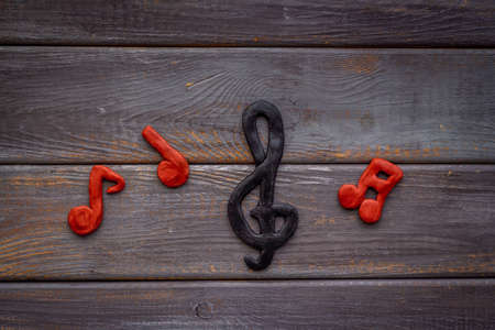 Abstract music notes made of rubber, top view. Music backgroundの写真素材