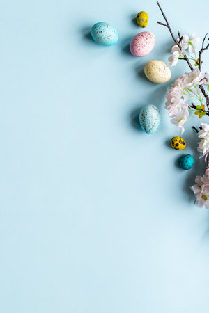 Easter eggs and spring flowers, top viewの写真素材