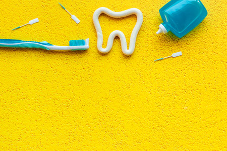 Toothbrush with tube of toothpaste and dental floss. Oral care and dental hygieneの写真素材