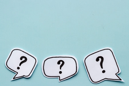 Question mark symbol on speech bubble, top view