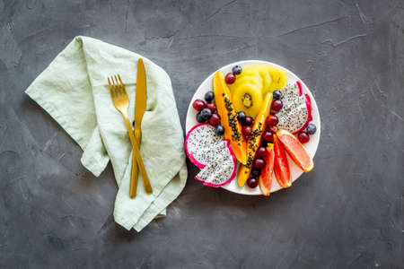 Exotic fruit dish with dragon fruit and papaya, top viewの写真素材