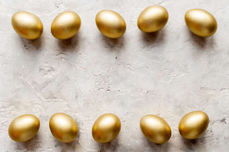 Golden eggs frame. Wealth and good luck concept. Easter decorationの写真素材