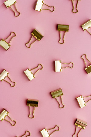 Paper binder clips pattern, copy space. Office supplies background