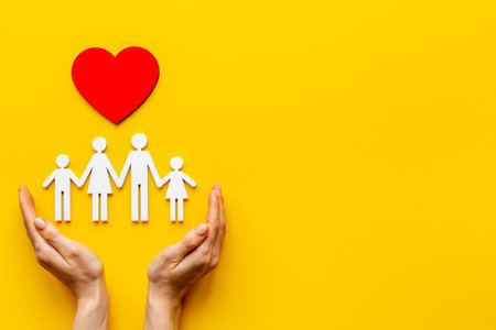 Health and medical care concept. Family figure with heartの写真素材