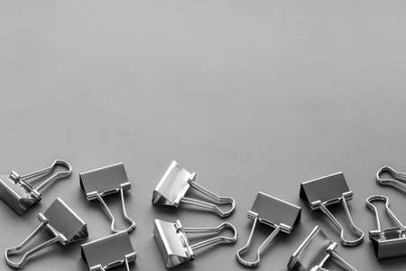 Paper binder clips. Stationery and office supplies background.の写真素材