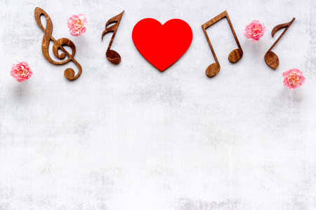 Love songs. Valentines day music with notes and flowersの写真素材