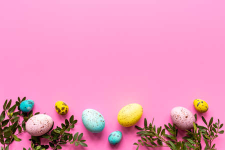 Easter decoration concept with eggs with spring branches and green leaves. Top viewの写真素材