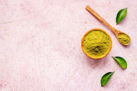 Raw matcha tea powder in wooden bowl. Natural healthy drinkの写真素材