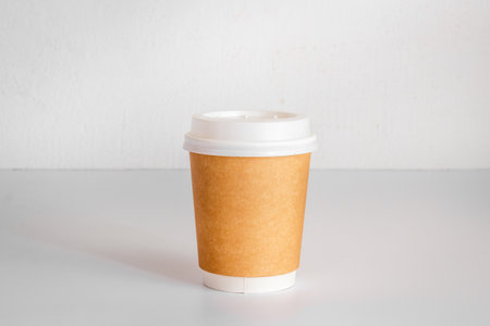 Take out coffee paper cup on the table. Close upの写真素材