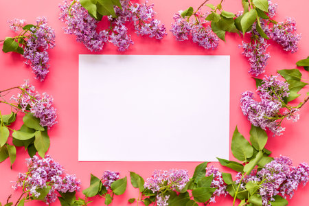 Frame of purple flowers - spring lilac branches with space for text
