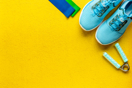 Fitness and gym equipment with sneakers, copy spaceの写真素材