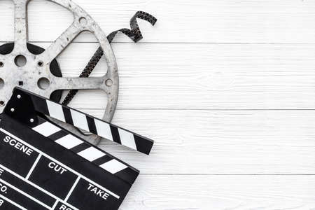 Big film reel with movie clapperboard, top view. Cinema conceptの写真素材