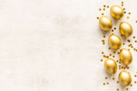 Set of golden eggs with space for text. Easter decoration. Overhead viewの写真素材
