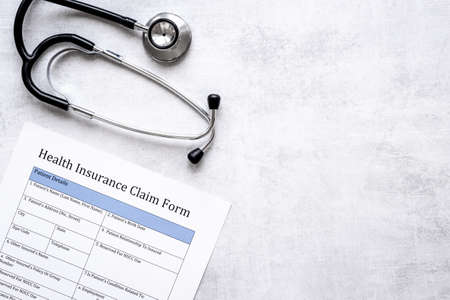 Life and health insurance concept. Health insuranse claim form, top viewの写真素材