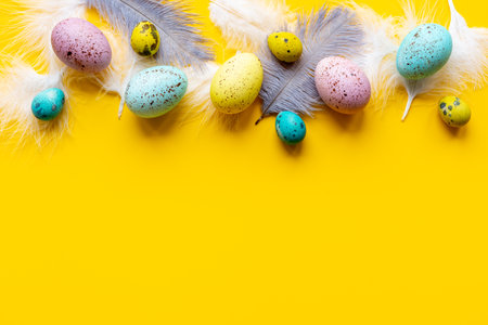 Happy Easter card with colorful eggs and feather. Overhead viewの写真素材