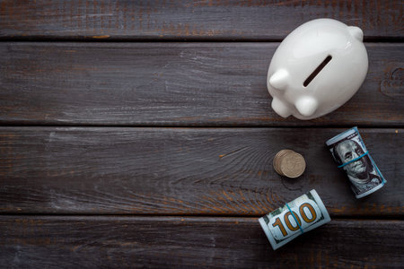 Piggy bank with money, top view