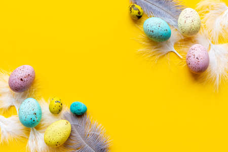 Easter eggs with birds feather. Decoration concept, top viewの写真素材