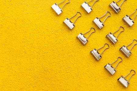 Flat lay of paper binder clips, office supplies patternの写真素材