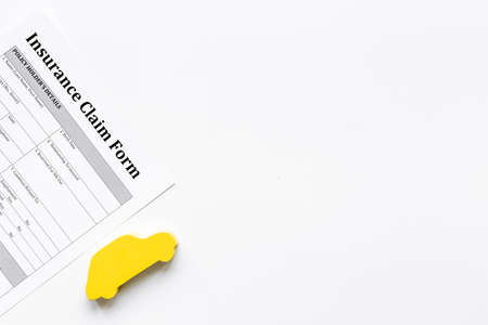 Insurance claim form with car shape. Top viewの写真素材