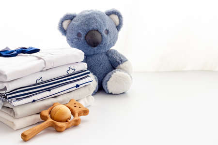 Stack of baby clothers and toys. Set of baby accessories, close upの写真素材
