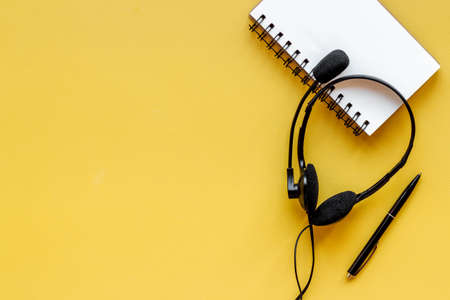 Voip headset on office desk. Call center support or customer service helpの写真素材