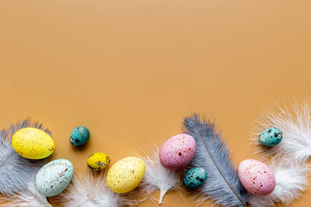 Easter eggs with birds feather. Decoration concept, top viewの写真素材