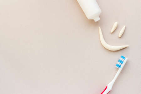 Dental hygiene concept. Smile shape with toothbrush, top viewの写真素材