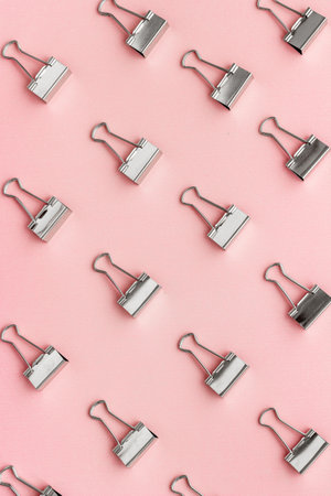 Paper binder clips pattern, copy space. Office supplies backgroundの写真素材