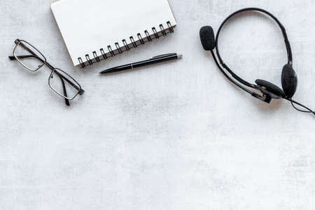 Communication support call center. Voip headset on offise deskの写真素材