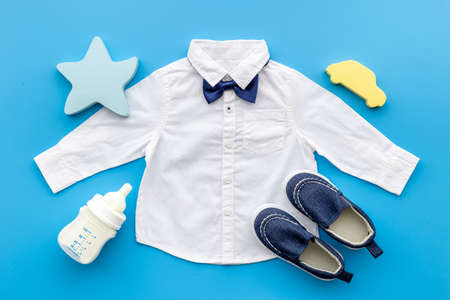 Bodysuit shirt and shoes for baby boy. Baby flat lay backgroundの写真素材