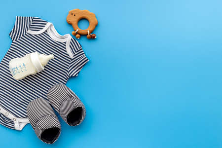 Baby shirt bodysuit with bottle of milk and kids accessoriesの写真素材
