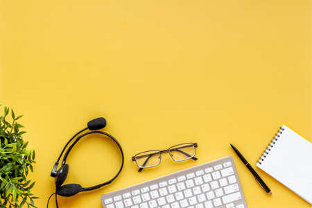 Communication support call center. headset and computer laptop, top viewの写真素材