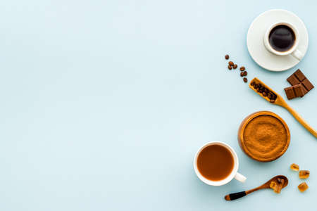 Background with assorted coffee and cocoa - beans with powder and hot drink