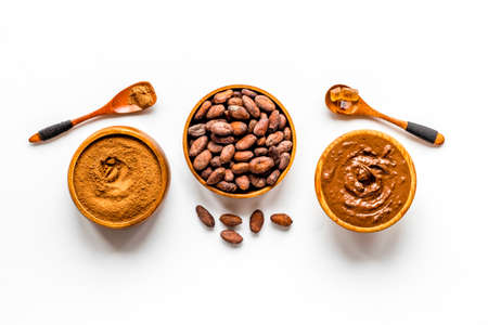 Chocolate and cocoa beans with ground powder, top view