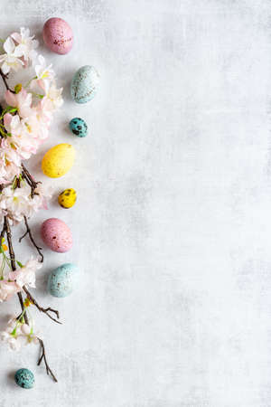 Easter eggs and spring flowers, top viewの写真素材