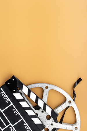 Big film reel with movie clapperboard, top view. Cinema conceptの写真素材