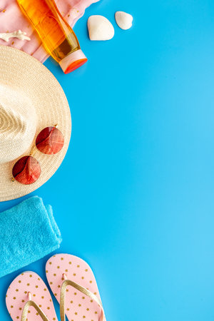 Layout of beach accessories with sraw hat, sunglasses and flip flopsの写真素材