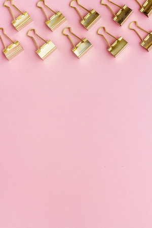 Paper binder clips. Stationery and office supplies background.の写真素材