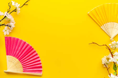 Hand fans and blossom branchesの写真素材