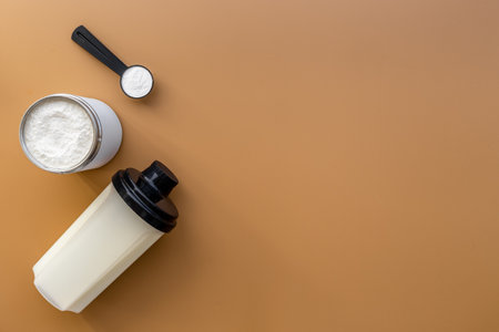 Whey protein powder in scoop and shaker with sport nutritionの写真素材