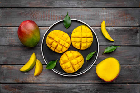 Mango slices and cubes in plate for fresh summer dinnerの写真素材