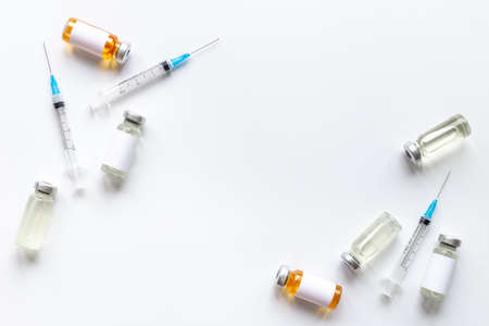 Medicine bottle for injection. Coronavirus vaccine ampoules with syringeの写真素材