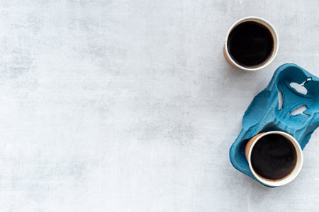 Coffee to go background. Black coffee in paper cups, top viewの写真素材