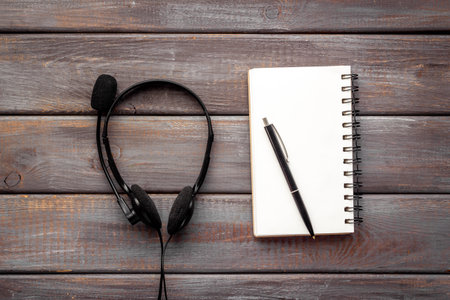 Voip headset on office desk. Call center support or customer service helpの写真素材