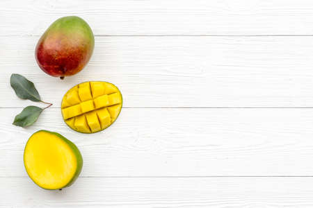 Mango fruits and slices. Tropical fruits backgroundの写真素材