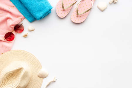 Layout of beach accessories with sraw hat, sunglasses and flip flopsの写真素材